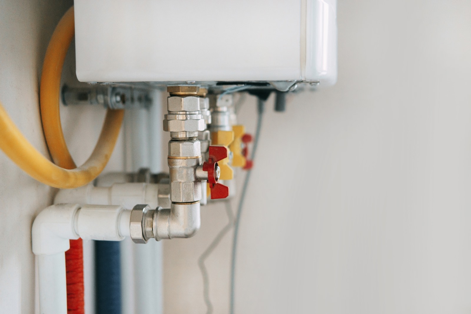 Boiler with pipework and isolation valves, serviced by GPM London's Gas Safe engineers